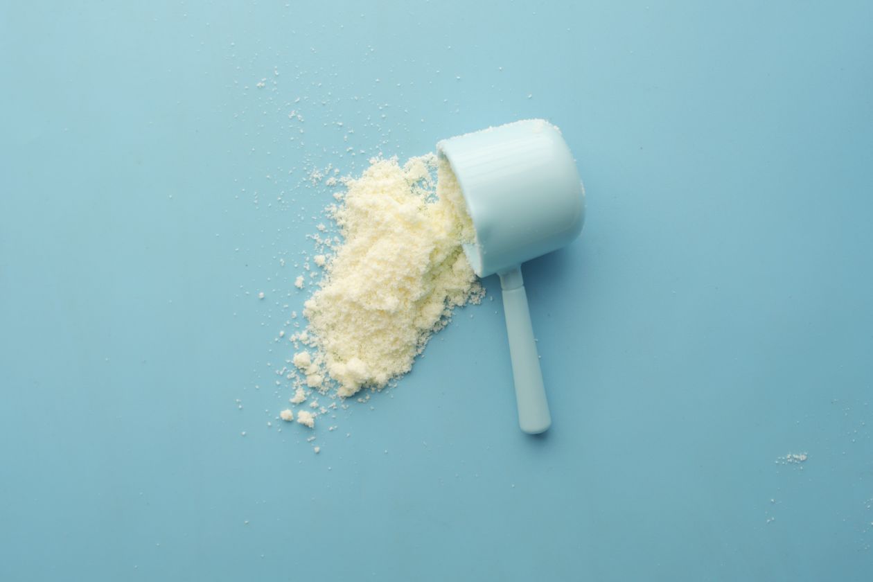 Pharmaceutical powder measured with a scoop in a lab