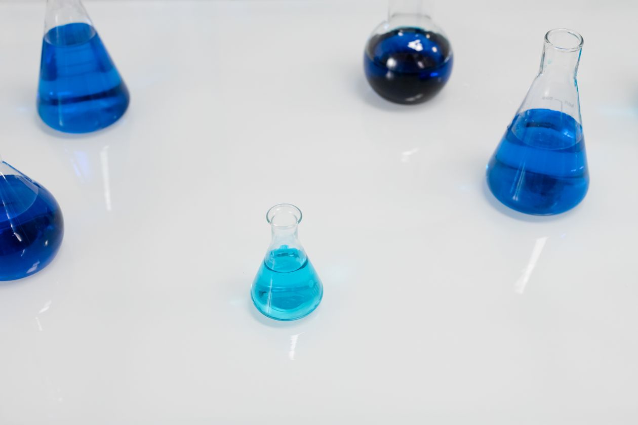 Amber oral solution bottles on a laboratory bench